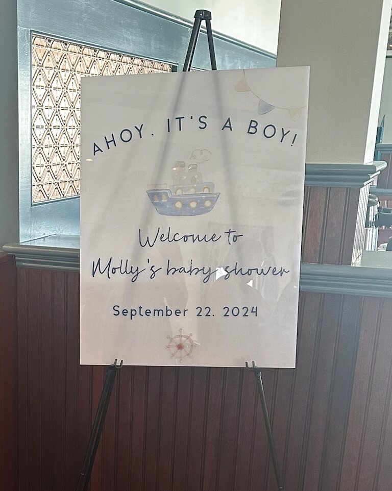 Ahoy it’s a boy nautical baby shower welcome sign on an easel
